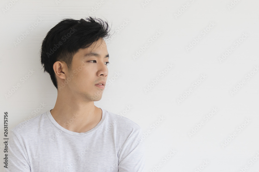 Young Asian man model in T-shirt crossed arm.. Young Asian man model in T-shirt crossed arm..