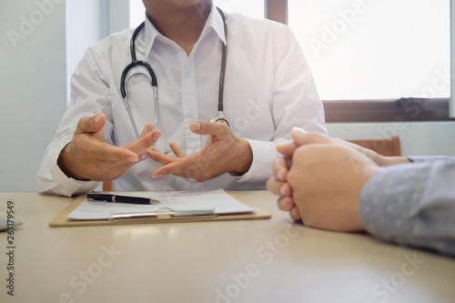 Patient having consultation with doctor in office