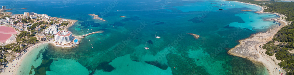 Fototapeta premium Colonia Sant Jordi, Spain. Amazing drone aerial landscape of the charming beaches Estanys and Es Trencs. Turquoise caribbean sea