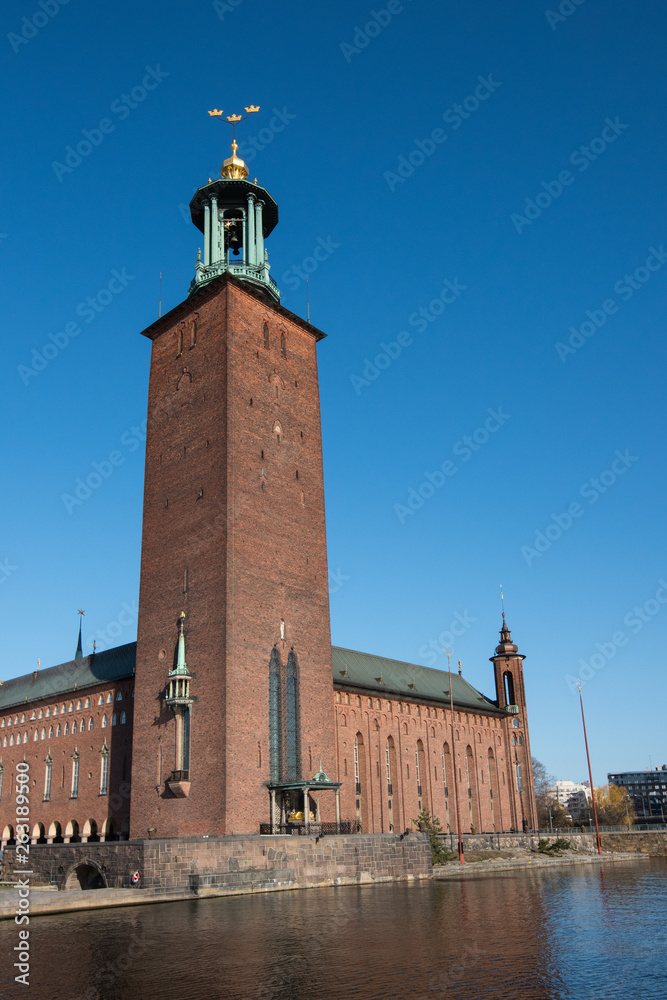 Fototapeta premium Water view over the Riddarfjärden bay in Stockholm a spring day at sunrise from the Riddarholmen island and Evert Taubes terrass.