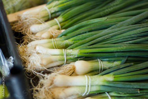 Fresh leek in a box at the market