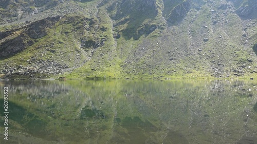 Beautiful tranquil lake in heart of mountains, Balea glacial lake, Transylvania