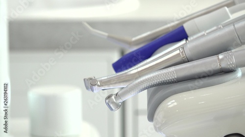 Doctor hand arrange dentist medical tools, close up focus on detail