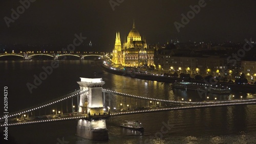 Hungarian Parliament and Sz??chenyi Chain Bridge over Danube river in Budapest photo