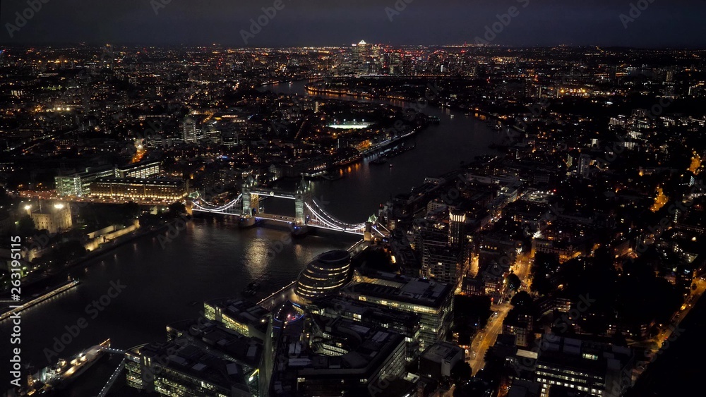 Fototapeta premium Aerial top view wide angle night panorama of London City and Tower Bridge