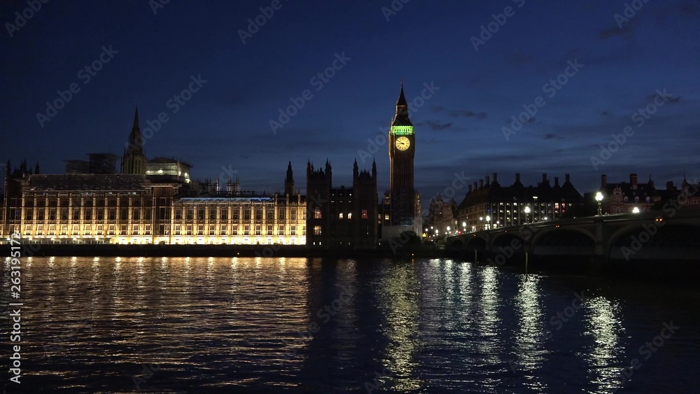 London Parliament (Palace of Westminster), Big Ben clock tower and Westminster Bridge reflected in Thames by night