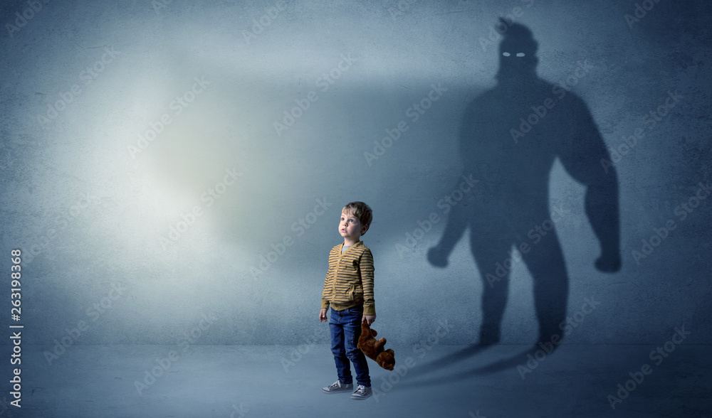 Cute kid in a room with plush on his hand and hero shadow on his background
Cute kid in a room with plush on his hand and hero shadow on his background