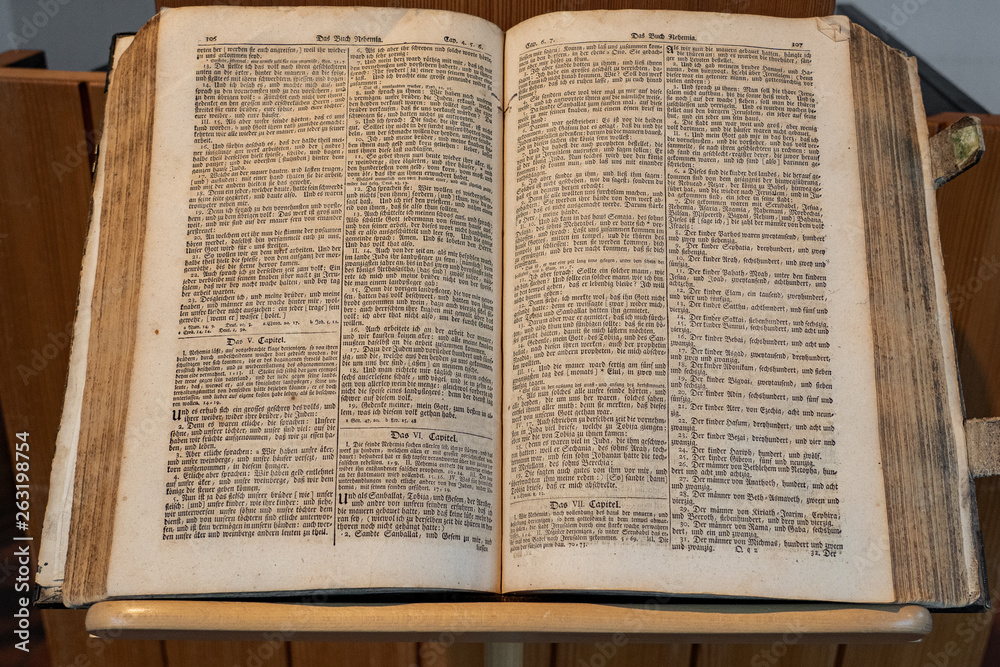 Fototapeta premium Bible is a open book. Stands open in a Swiss reformation Church on day of Konfirmation in a Swiss church.