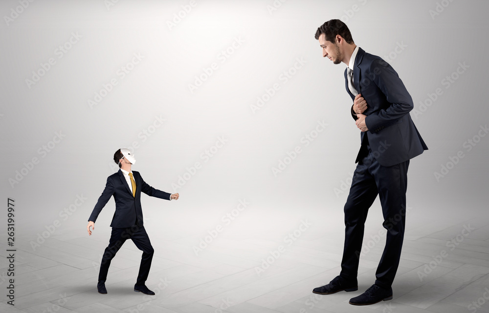 Fototapeta premium Conflict between small masked businessman and big elegant businessman 
