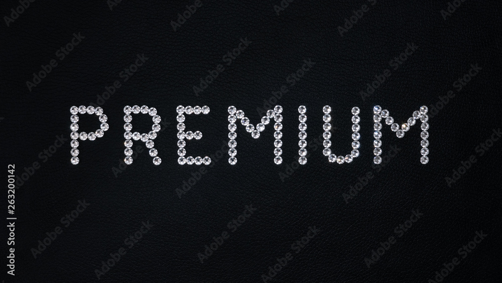 Obraz premium Word Premium made of shiny white swarovski crystals placed on black leather