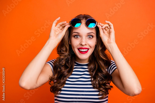 Close up portrait of pretty attractive cheerful lovely positive nice glad optimistic in modern dress top she her lady looking at you camera isolated vivid vibrant background