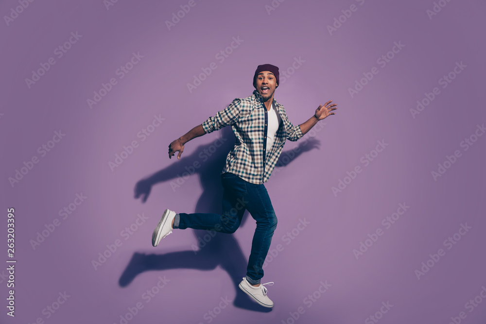 Ful length body size photo portrait of cheerful excited in denim modern trousers white shoes sneakers guy student isolated violet background Ful length body size photo portrait of cheerful excited in denim modern trousers white shoes sneakers guy student isolated violet background