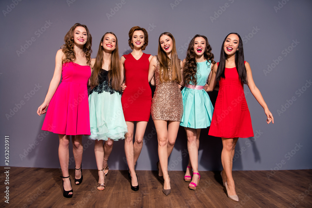 Full length body size photo beautiful she her six ladies walk go step move festive social college school graduation bonding wear fashion sparkly colorful formal-wear dresses isolated grey background Full length body size photo beautiful she her six ladies walk go step move festive social college school graduation bonding wear fashion sparkly colorful formal-wear dresses isolated grey background