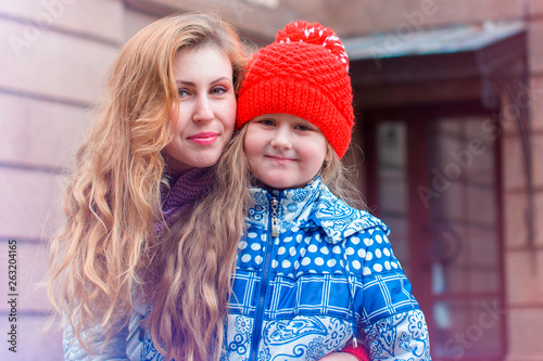 Mom with child walking outdoor, warm weather. Lifestyle portrait parents and kids in happiness , moments of life 