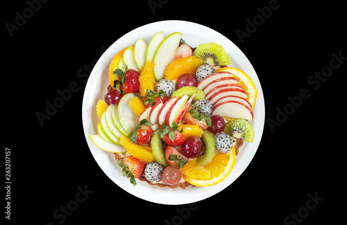 fruit tart on plate isolated on black background.clipping path,aerial view