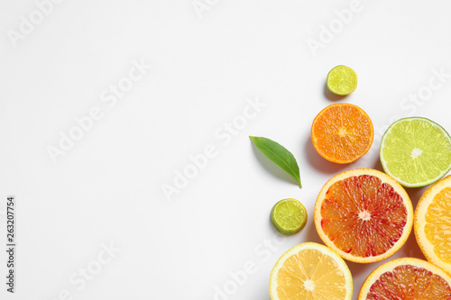 Composition with different citrus fruits on white background  top view