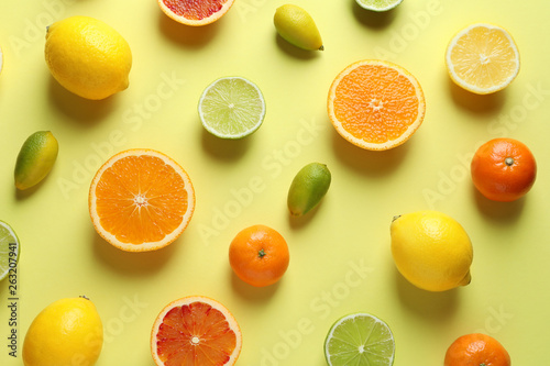 Different citrus fruits on color background  flat lay
