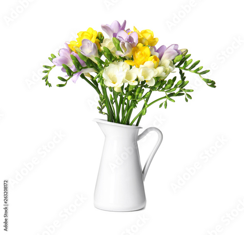 Wallpaper Mural Bouquet of fresh freesia flowers in jug isolated on white Torontodigital.ca