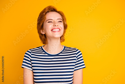 Close-up portrait of her she nice lovely pretty charming attractive cheerful cheery optimistic girl laughing lol giggle chuckle isolated over bright vivid shine yellow background