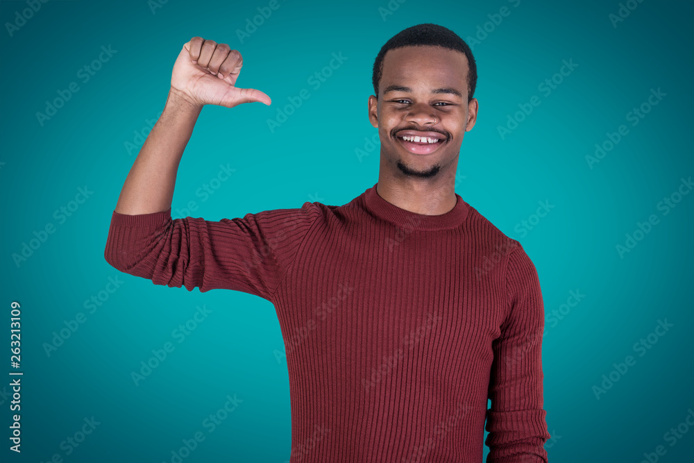 Smiling black man pointing at himself Smiling black man pointing at himself