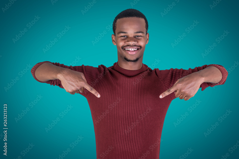 Cheerful African American man pointing at torso