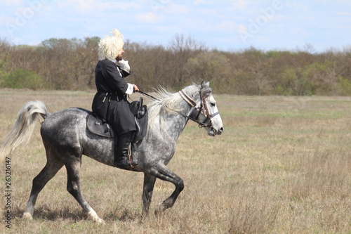Race horses and riders on them.