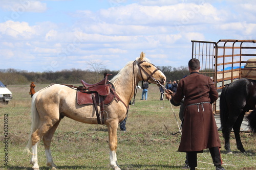 Race horses and riders on them.