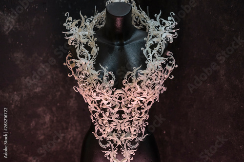 Piece made with 3d printer, is composed of white flowers that form a corset, handmade, fantasy design Baroque style photo