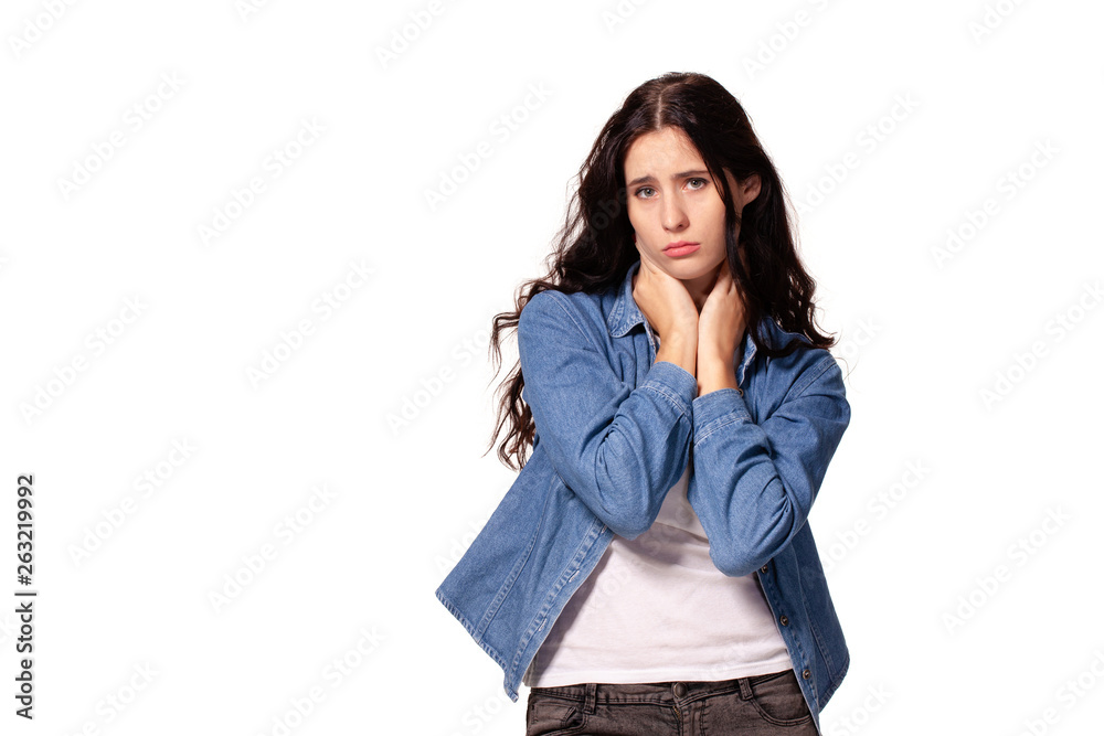 Beautiful and unhappy young woman with dark wavy hair looking into the camera with serious expression on her face. Beautiful and unhappy young woman with dark wavy hair looking into the camera with serious expression on her face.