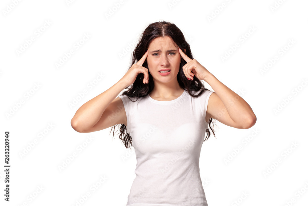 Young woman in white dress thinking and put fingers to her temples Young woman in white dress thinking and put fingers to her temples