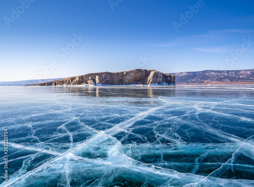 Transparent ice on Lake Baikal near Zamogoy island. Siberia, Russia