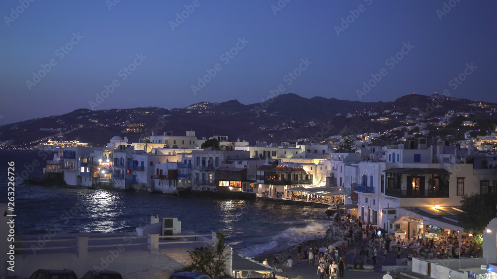 night time view of little venice on mykonos