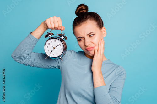 Close-up portrait of her she nice-looking attractive lovely lazy bored irritated mad girl holding in hands retro vintage clock late isolated over bright vivid shine turquoise background