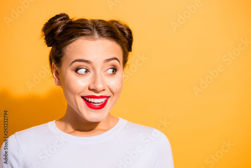 Close-up portrait of her she nice-looking attractive girlish feminine cheerful cheery funny teen girl looking aside isolated over bright vivid shine yellow background