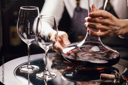 Staff training for sommelier experts. All that is needed is wine etiquette, the rules for buying wine for the customer, decanting and pouring wine into glasses. photo