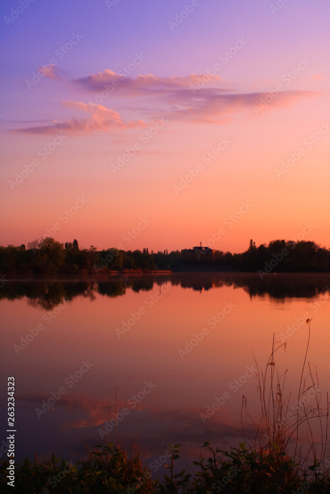 Pastoral decor in pastel colors. Sweet landscape with reflection of the sky in the sea at sunrise