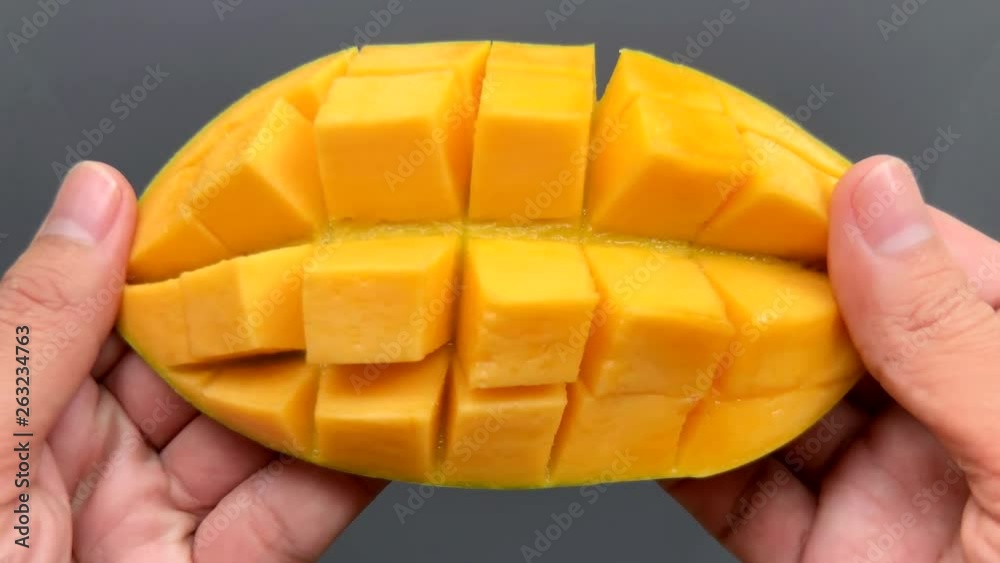 Open a cut mango in 4K resolution Open a cut mango in 4K resolution