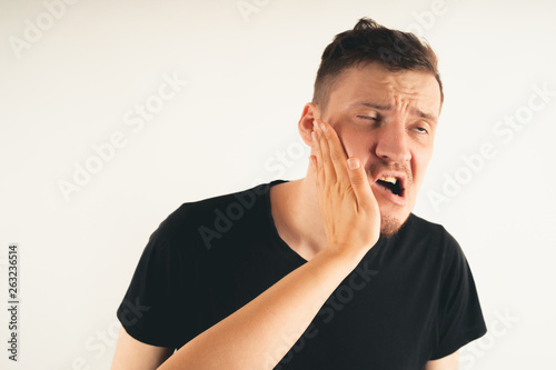 Fototapete Emotional male getting slapped in face while shouting with closed eyes in fear o
