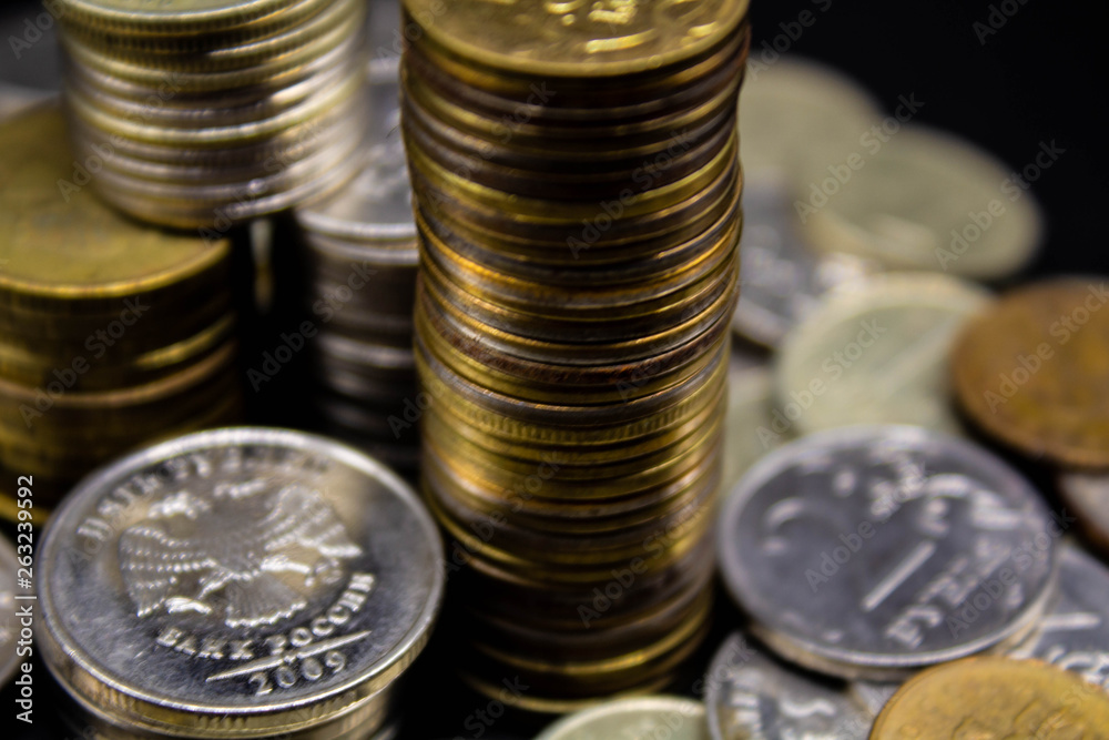Coins stack on black background in concept wall and strong money. Coins stack on black background in concept wall and strong money.