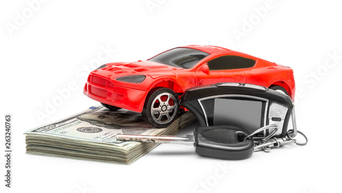  Car toy with car key and money on a white background.