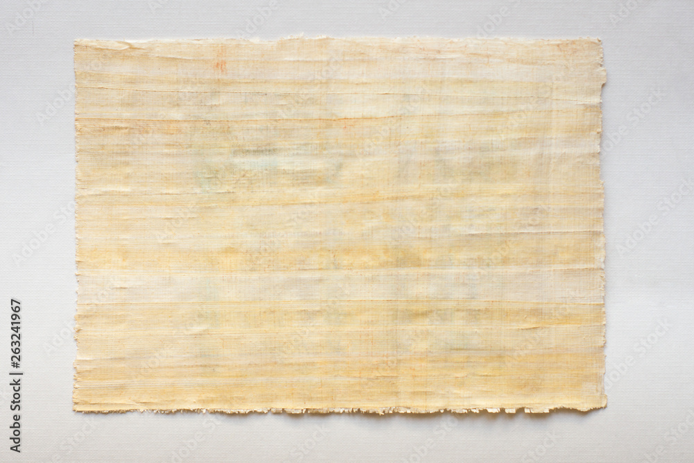 old parchment: papyrus sheet on white paper, horizontal photo