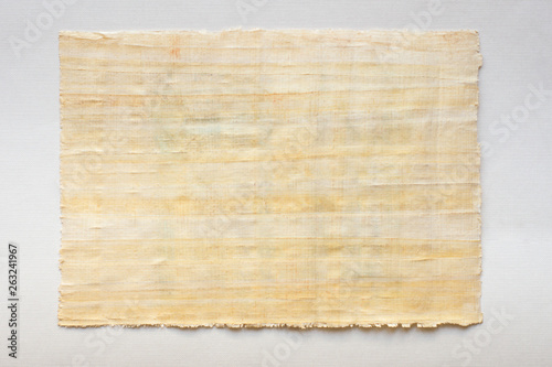 old parchment: papyrus sheet on white paper, horizontal photo