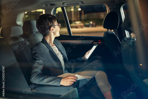 business woman traveling with car by night on business trip. © luckybusiness