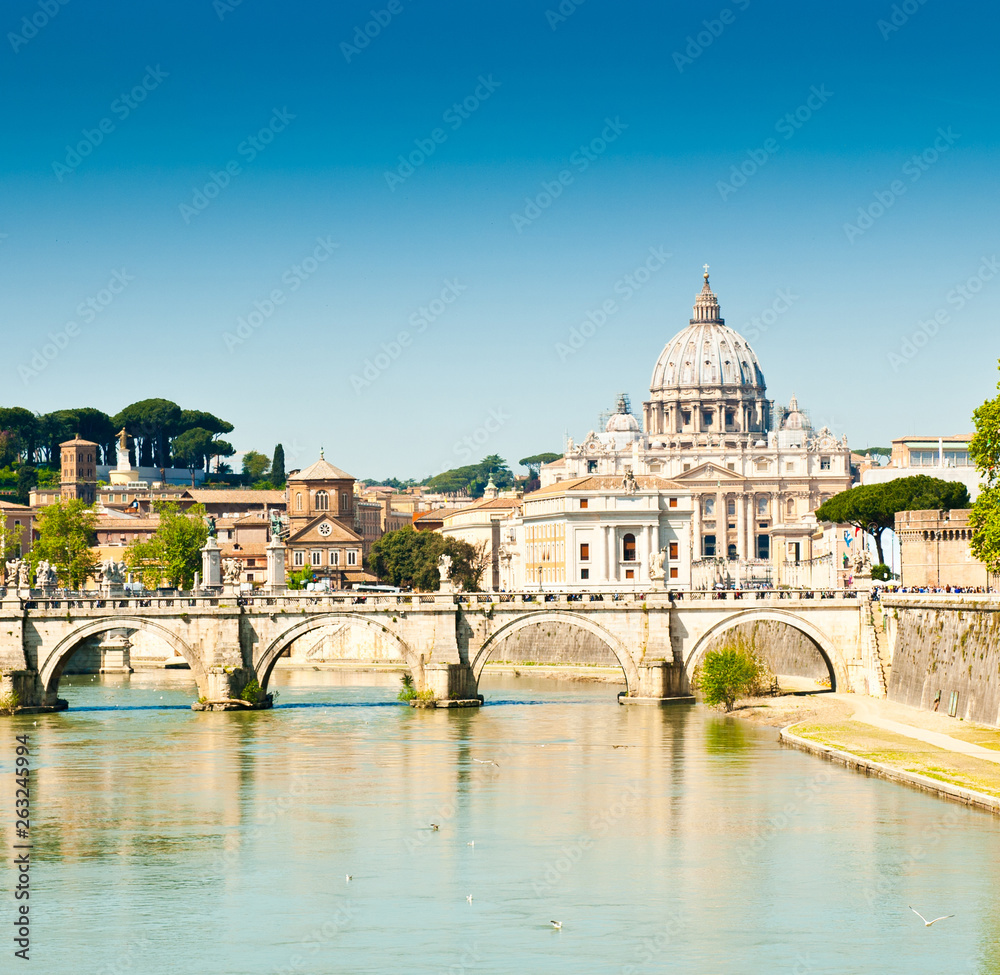 St. Peter's Basilica (Basilica Papale di San Pietro in Vaticano) and Tiber river. Sunny spring day in Rome, Italy
