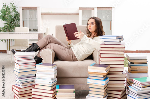 Young female student preparing for exams at home  © Elnur