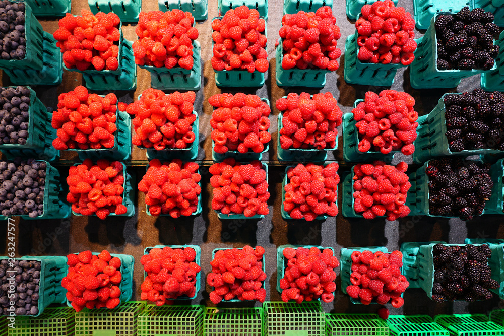 Containers of fresh berries at the farmers market
