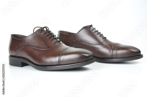 Classic men's brown shoes on white background. Leather shoes