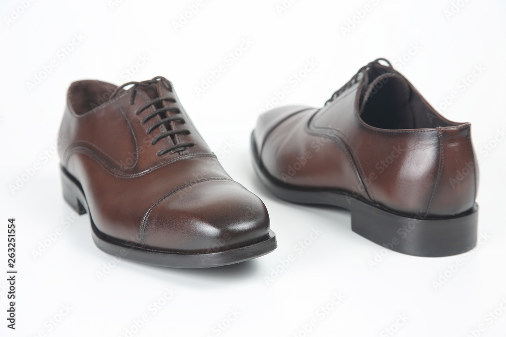 Classic men's brown shoes on white background. Leather shoes