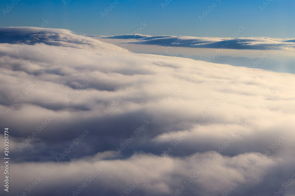 Naklejka premium Beautiful white clouds in blue sky. View from airplane