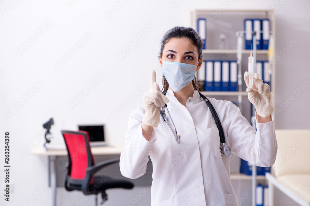 Young female doctor in infusion concept Young female doctor in infusion concept